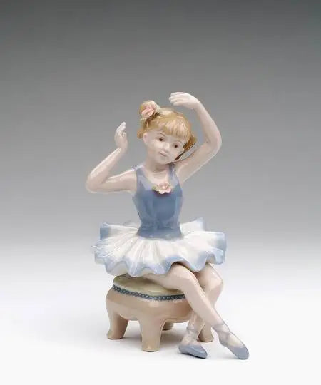 Porcelain Ballerina in Blue Dress Siting on Chair Figurine